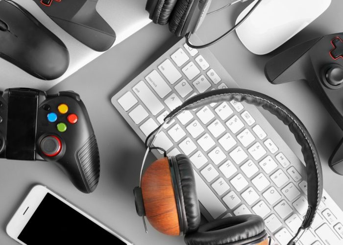 Gamepads,,Mice,,Headphones,And,Keyboard,On,Table